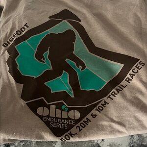 NWOT- Hanes Tan Tee with Brown & Teal Bigfoot Graphic